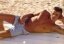 Hot Guy In Jeans Lying On The Beach